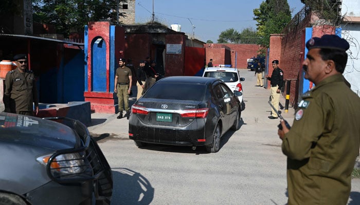 A convoy of vehicles carrying the special court judge Abual Hasnat Muhammad Zulqarnain, arrives at the Adiala Jail for the hearing of jailed former Pakistan prime minister Imran Khan, in Rawalpindi on October 23, 2023. — AFP