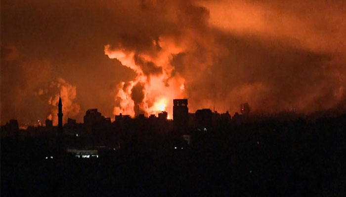 This image grab from an AFP TV footage shows balls of fire and smoke rising above Gaza City during an Israeli strike on October 27, 2023, as battles between Israel and Palestine continue. — AFP