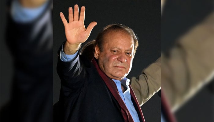Pakistan´s former prime minister Nawaz Sharif waves to his supporters gathered at Minar-e-Pakistan during an event held to welcome him in Lahore on October 21, 2023. — AFP
