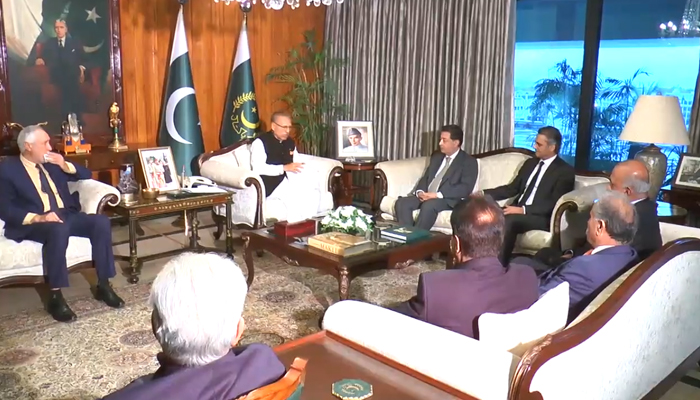 President Arif Alvi (centre right) meets ECP delegation and AGP Mansoor Usman Awan in Islamabad, on November 2, 2023, in this still taken from a video. — X/@PresOfPakistan
