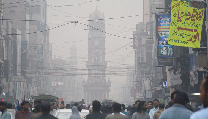 A view of heavy smog in morning hours at Ghanta Ghar Chowk in Faisalabad. — Online/File