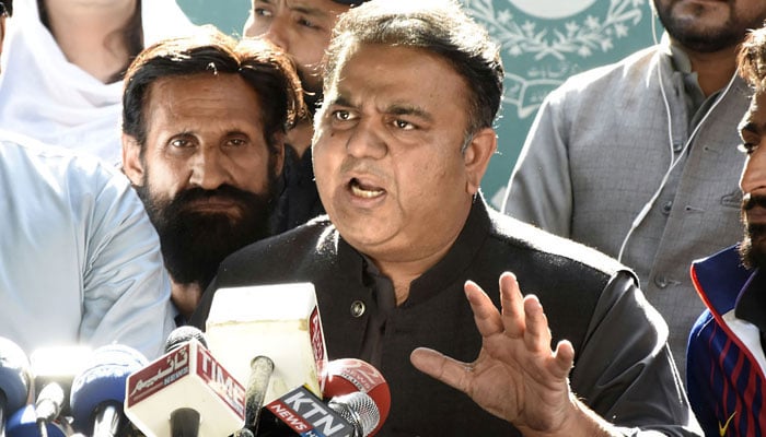 PTI senior leader Fawad Chaudhry talking to the media persons outside the ECP office in Islamabad. — Online/File