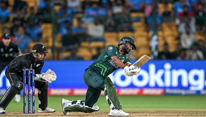 Pakistan´s Fakhar Zaman plays a shot during the 2023 ICC Men´s Cricket World Cup one-day international (ODI) match between New Zealand and Pakistan at the M. Chinnaswamy Stadium in Bengaluru on November 4, 2023. — AFP