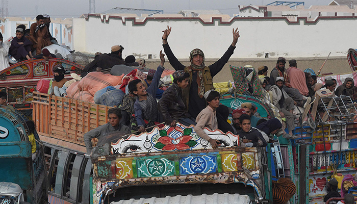 Afghan refugees arrive on trucks to cross the Pakistan-Afghanistan Chaman border on November 4, 2023, following Pakistans government decision to expel people illegally staying in the country. — AFP