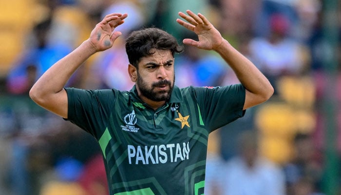 Pakistans Haris Rauf reacts after a delivery during the World Cup 2023 match between New Zealand and Pakistan at the M Chinnaswamy Stadium in Bengaluru on November 4, 2023. — AFP