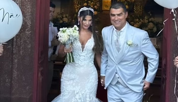 Cristiano Ronaldos brother has celebrated his 25th wedding anniversary in a lavish ceremony in Madeira. Hugo and Rubina Aveiro are pictured. — Instagram/@elmaaveiro