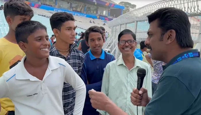 Fans at the Eden Gardens talk about watching the Pakistan team practice in this still taken from a video. — Geo News