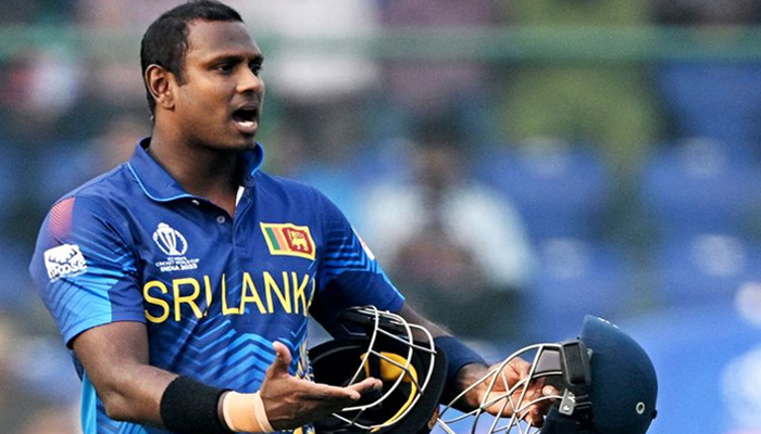 Sri Lanka’s Angelo Mathews reacts after he was timed out during the 2023 ICC Mens Cricket World Cup match against Bangladesh on November 6, 2023. — AFP