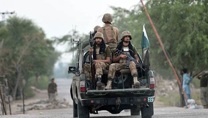 Security forces travelling in a military vehicle. — AFP