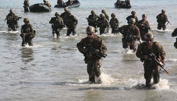 Philippine and US Marines simulate a beach landing from combat rubber raiding crafts onto a small island off the coast of Palawan, Philippines, Oct. 2 during Amphibious Landing Exercise 2015. — US Marine Corps