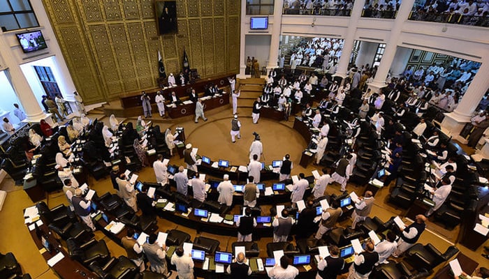 This photograph taken on August 13, 2018 shows legislators taking oath during a session of the KP Assembly after July 25 general election, in Peshawar. — AFP