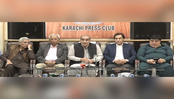 Khawaja Saad Rafique (centre) addresses a presser in Karachi on November 12, 2023, in this still taken form a video. — YouTube/Geo News Live
