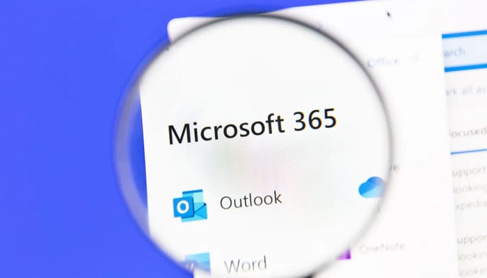 A desktop display showing Microsoft, Outlook and Word logos. — Microsoft