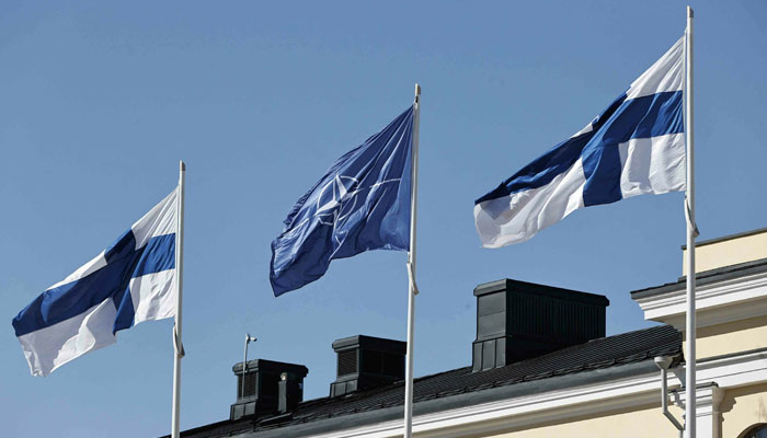 Finnish and Nato flags flutter at the courtyard of the Foreign Ministry in Helsinki, Finland, ahead of accession to Nato on April 4. — AFP