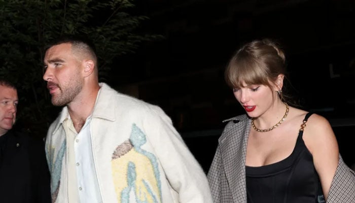 Taylor Swift and Travis Kelce walking towards their car. — X/@johnnynunez