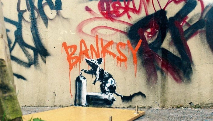 A graffiti made by artist Banksy. — Banksy