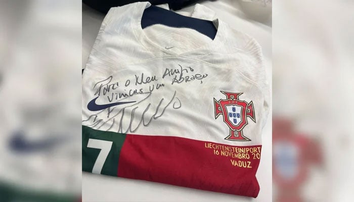 Cristiano Ronaldos signed Portugal jersey that he gifted to Real Madrids Vinicius Junior. — Instagram/@vinijr