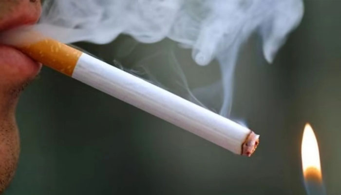 A person smoking a cigarette. — AFP/File