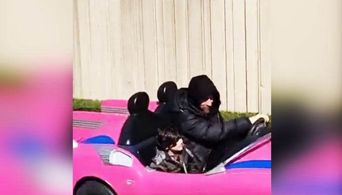 Inter Miami superstar soccer player Lionel Messi (right) is driving a theme park car at Disneyland Paris in this still taken from a video. X/ @M30Xtra/File