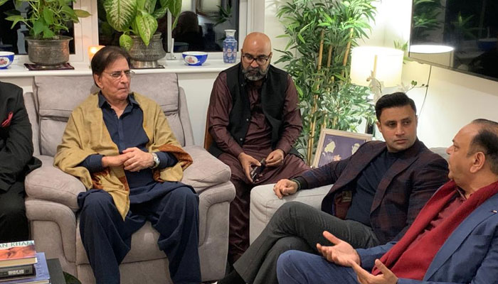 PTIs Zulfi Bukhari and Sahibzada Jahangir with other party leaders in High Wycombe. — Reporter