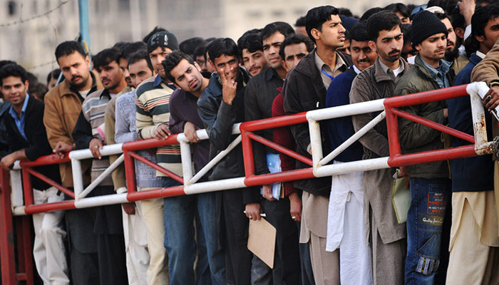 Pakistani youth wait for their turn for a Capital Development Authority (CDA) job entry test in Islamabad on January 27, 2010. — AFP