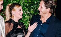 Margot Robbie's Bottom Gets Pinched By Husband On Red Carpet