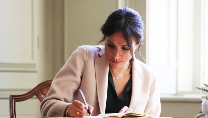 Meghan Markle reading her mouthpiece Omid Scobies Endgame