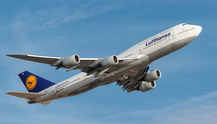 A Lufthansa airplane flies in the sky. — Lufthansa