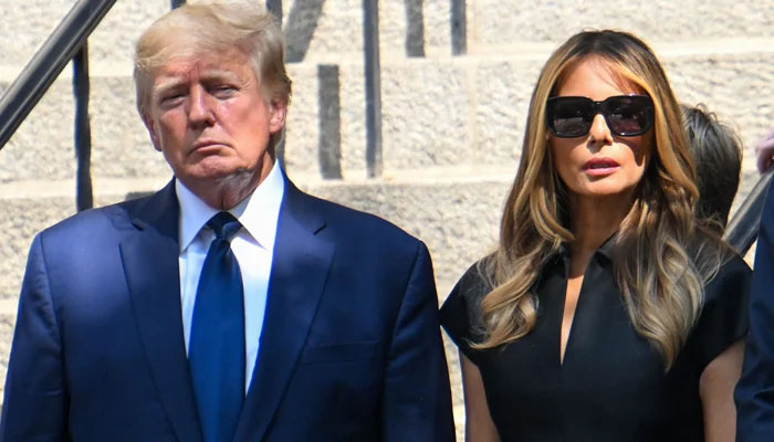 Former President Donald Trump and Melania Trump exit the funeral of Ivana Trump at St Vincent Ferrer Roman Catholic Church on July 20, 2022, in New York City. — AFP