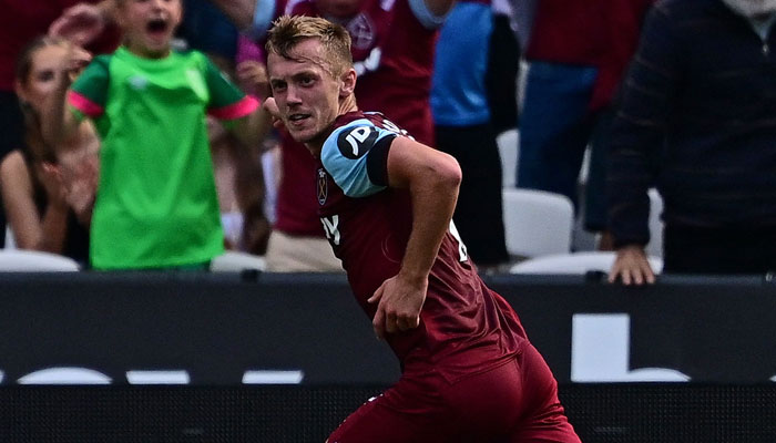 West Ham United´s English midfielder James Ward-Prowse celebrates scoring the opening goal during the English Premier League football match between West Ham United and Manchester City at the London Stadium, in London on September 16, 2023. — AFP