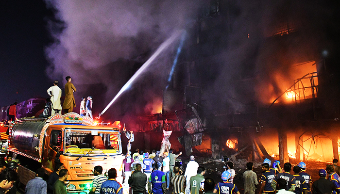 Firefighters try to control blazes that broke out at furniture shops at Ayesha Manzil in Karachi on December 06, 2023. — Online