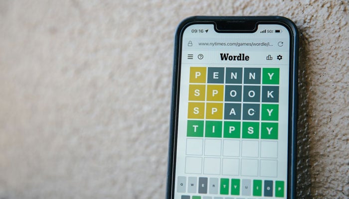 A Wordle puzzle displayed on a phone. — Unsplash