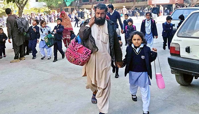 Children on the way to their school as educational institutions are reopened after winter vacations. — APP