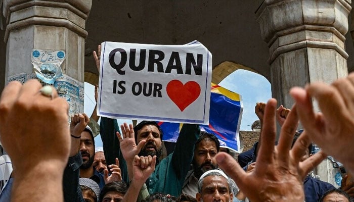 People take part in a demonstration in Peshawar on July 7, 2023, as they protest against the burning of the Holy Quran outside a Stockholm mosque that outraged Muslims around the world. — AFP/File