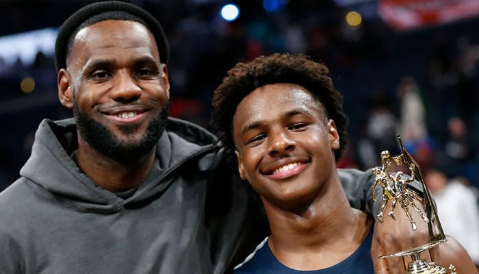 LeBron James  poses with his son Bronny after Sierra Canyon beat Akron St Vincent - St Mary in a high school basketball game, Saturday, December 14, 2019, in Columbus, Ohio. — X/@jaylaprete