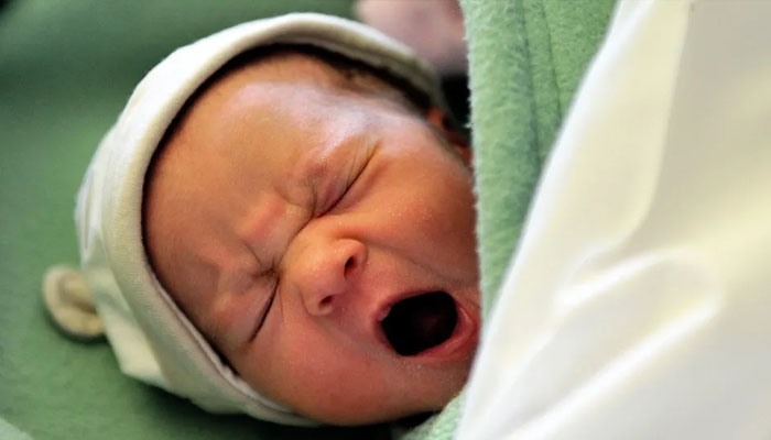 A picture of a baby yawning. — AFP/File