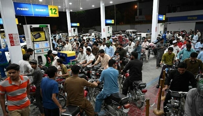 Motorists wait to fill their vehicles’ tanks at a petrol station in Islamabad on June 2, 2022. — AFP