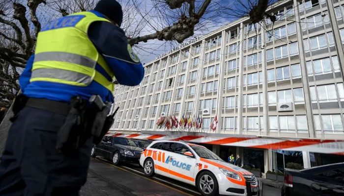 Swiss police stand guard outside a hotel in Geneva on January 14, 2015. — AFP File