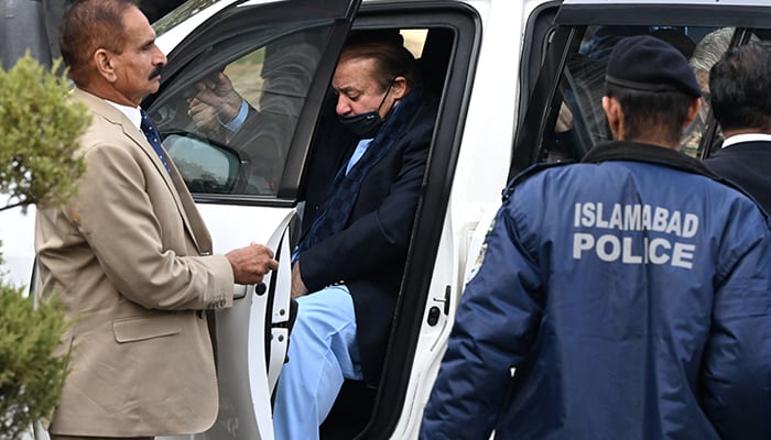 Former prime minister Nawaz Sharif (left) arrives to appear before the Islamabad High Court on December 7, 2023. — AFP