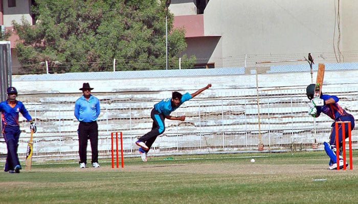 A view of a cricket match between HBL and SSGC at Niaz Stadium in Hyderabad. — APP/File