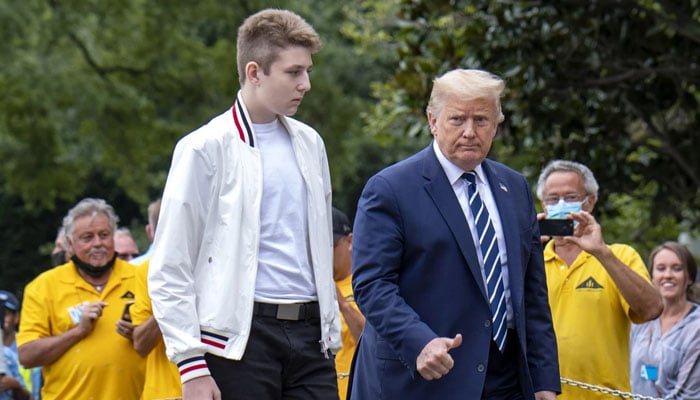 Donald Trump returns to the White House with his son Barron after a weekend in Bedminster, NJ, on Aug 16. — AFP