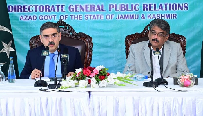 Caretaker Prime Minister Anwaar-ul-Haq Kakar addressing a press conference (left) alongside AJK Prime Minister Chaudhry Anwaar-ul-Haq. — PID