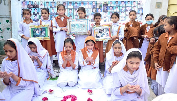 Students recite a prayer for martyrs of the APS attack on December 16, 2023. — APP