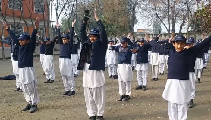 Students are exercising during the assembly drill in this still taken from a video. — Facebook/ Govt Higher Secondary School #2 Nowshera Cantt/File