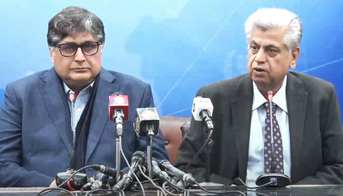 Caretaker ministers Fawad Hassan Fawad, and Murtaza Solangi address a joint press conference in Islamabad on December 21, 2023, in this still taken from a video. — YouTube/GeoNews