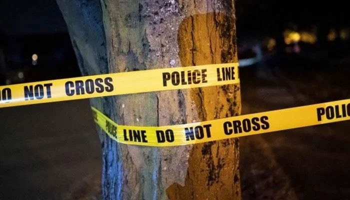 A representational image of a police tape wrapped on a tree at a crime scene. — AFP/File