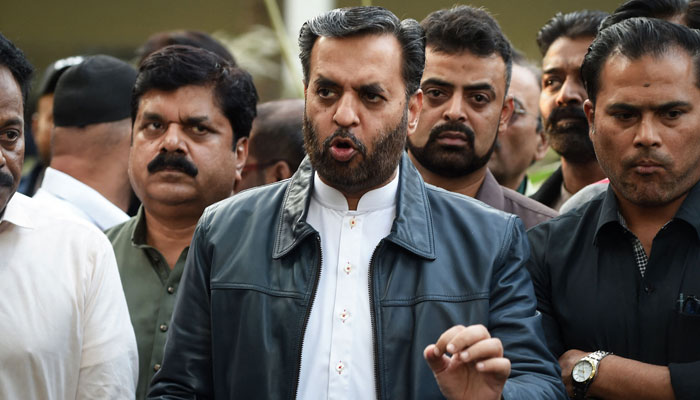 MQM-P Senior Deputy Convener Syed Mustafa Kamal speaks to the media after submitting nomination papers at the deputy commissioners office in Karachi on December 22, 2023, ahead of the upcoming 2024 general polls. — AFP
