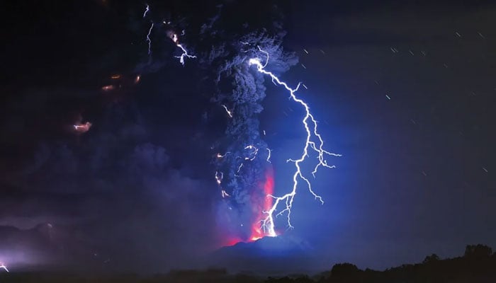 A massive lightning strike in the night sky. — AFP/File
