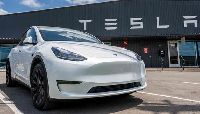 A Tesla Y model car stands outside its showroom. — AFP/File