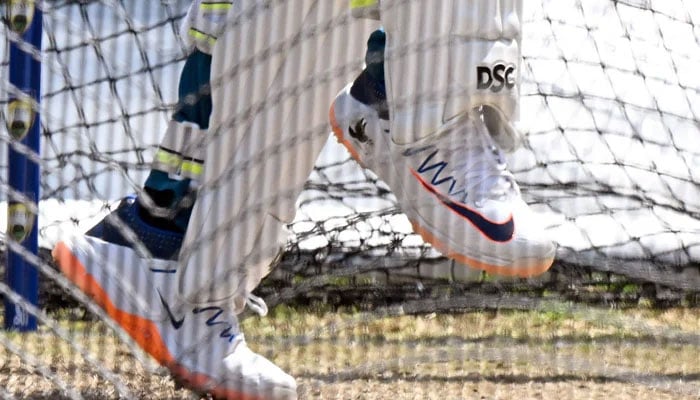A dove symbol is seen on the shoe (R) of Australia’s Usman Khawaja as he bats in the nets during a practice session at the Melbourne Cricket Ground (MCG) in Melbourne on December 24, 2023, ahead of the second cricket Test match against Pakistan. — AFP